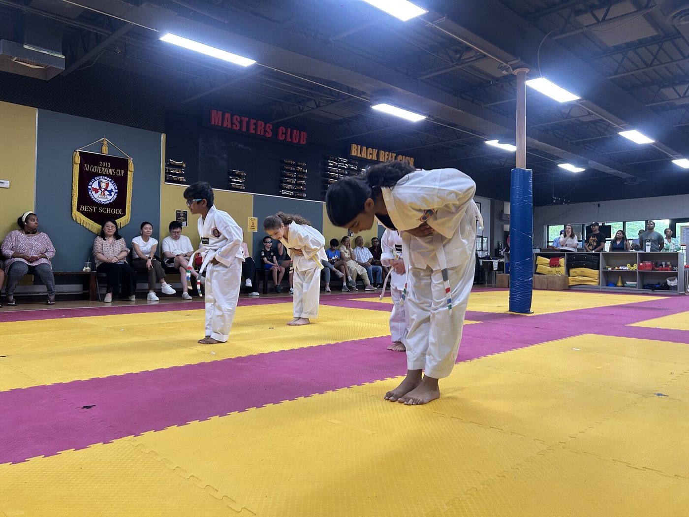 Color belt students bowing at the start of their August 2026 Belt Test