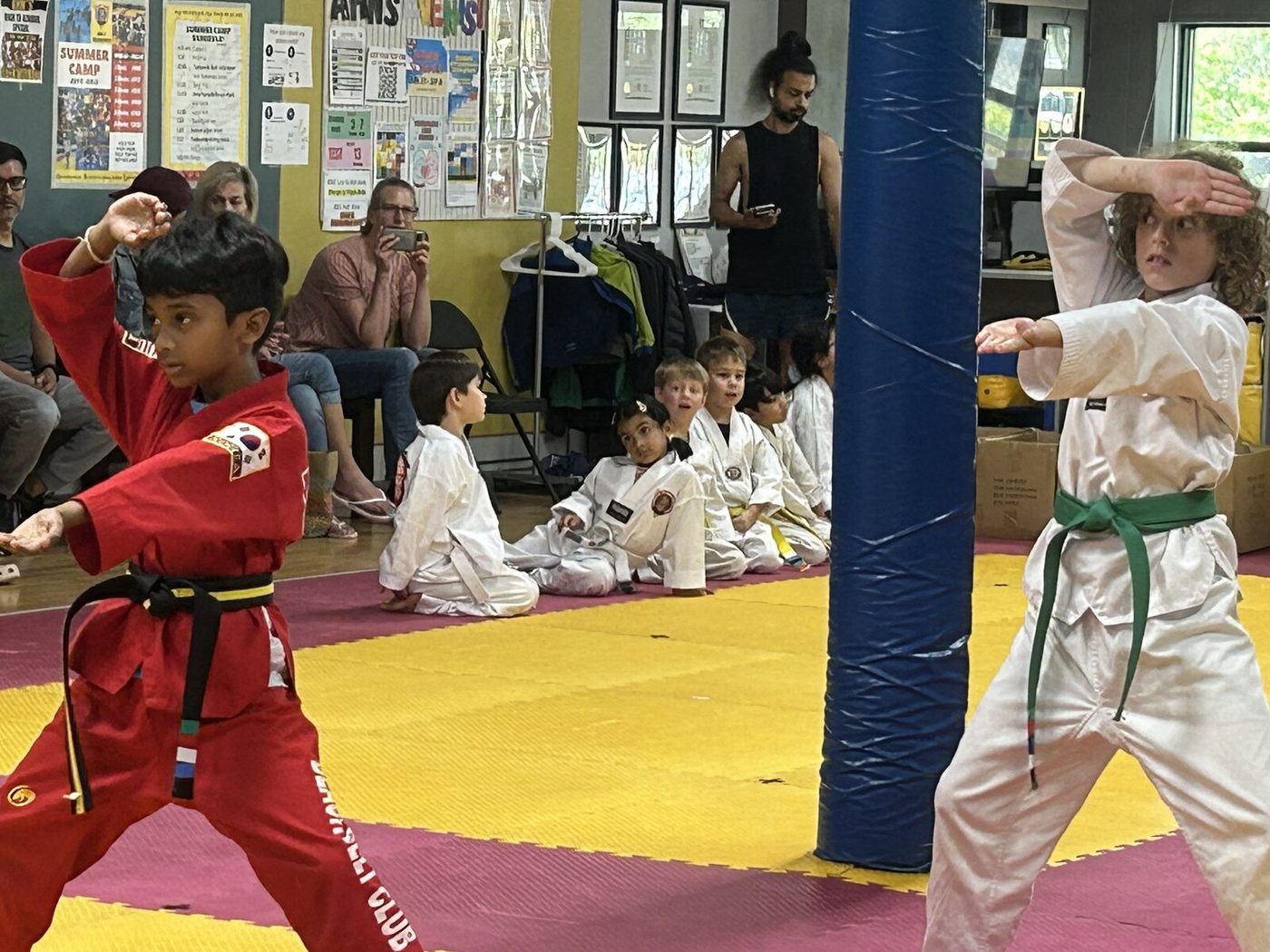 Two students demonstrating their form side by side during the belt test