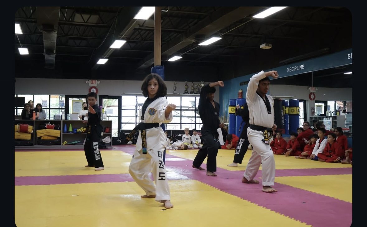 Black belt students performing poomsae at Ahn's Taekwondo