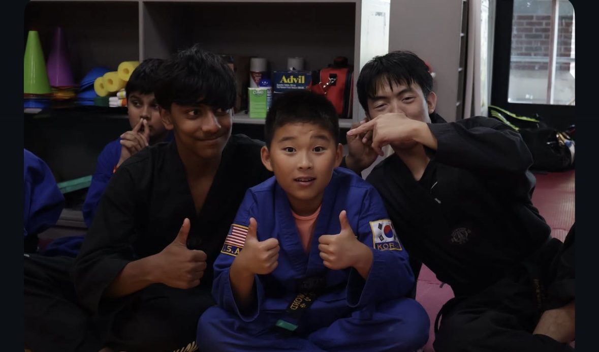 Ahn's Taekwondo students giving a thumbs up after class