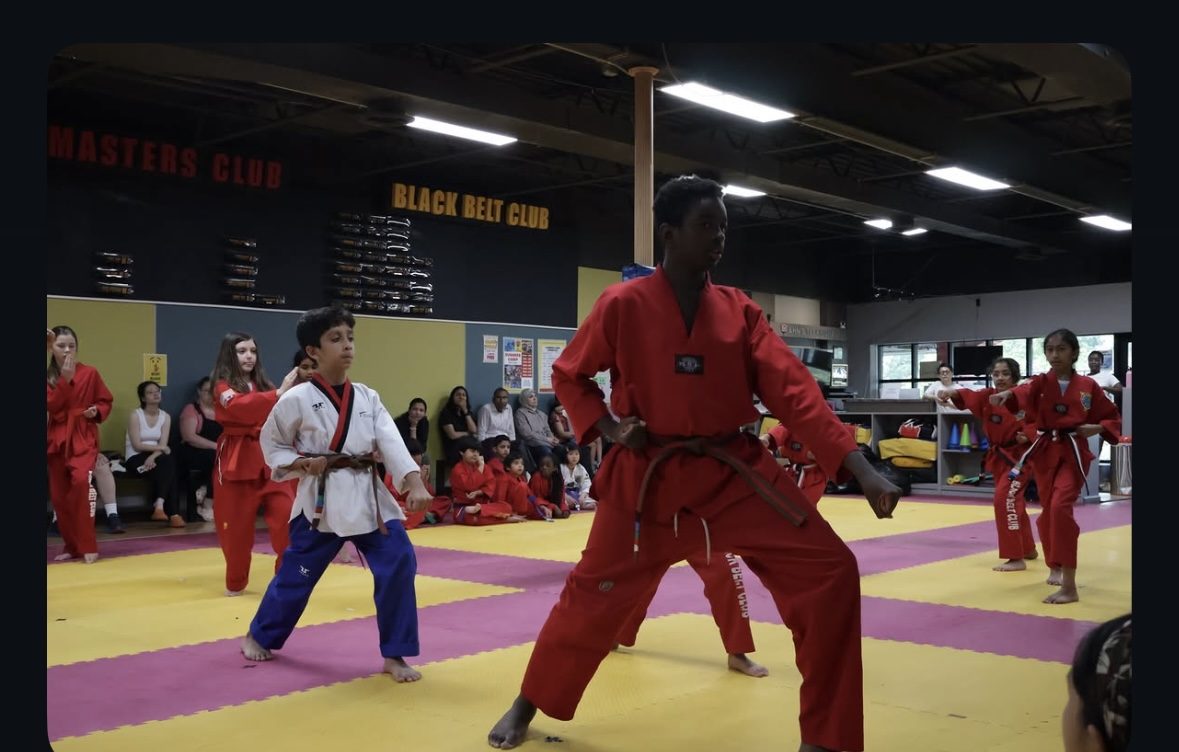 Teen students practicing poomsae forms at Ahn's Taekwondo