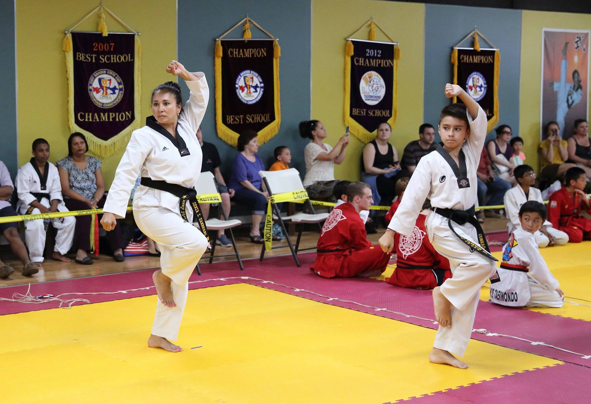 Ahn's Taekwondo students practicing kicks in the dojang
