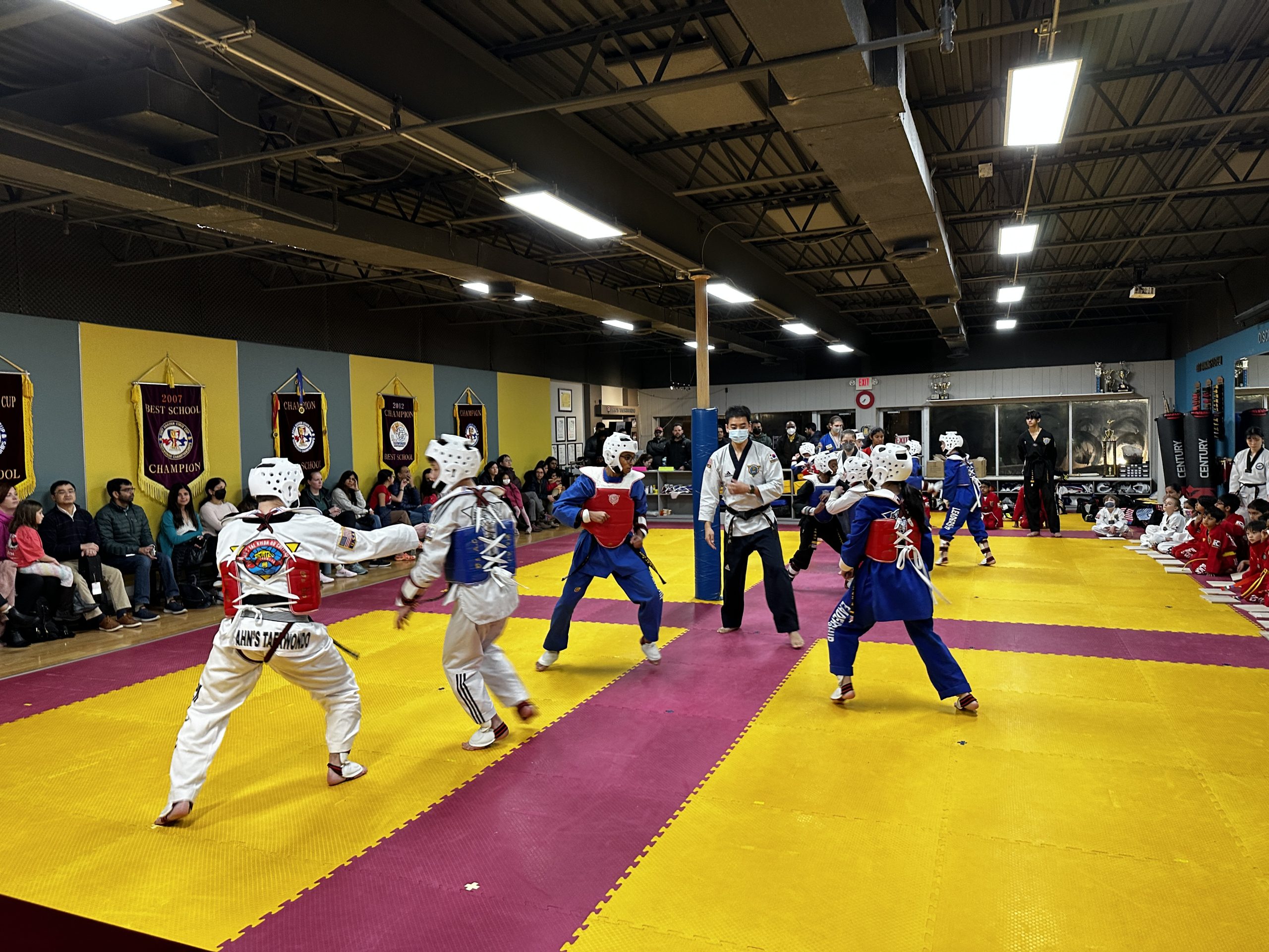 Ahn's Taekwondo students sparring at a tournament