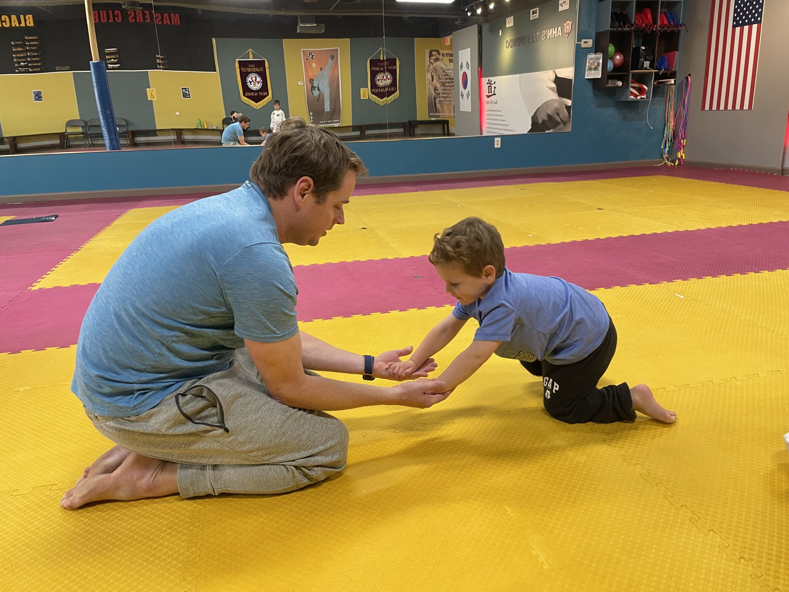 Family exercising together at Ahn's Taekwondo