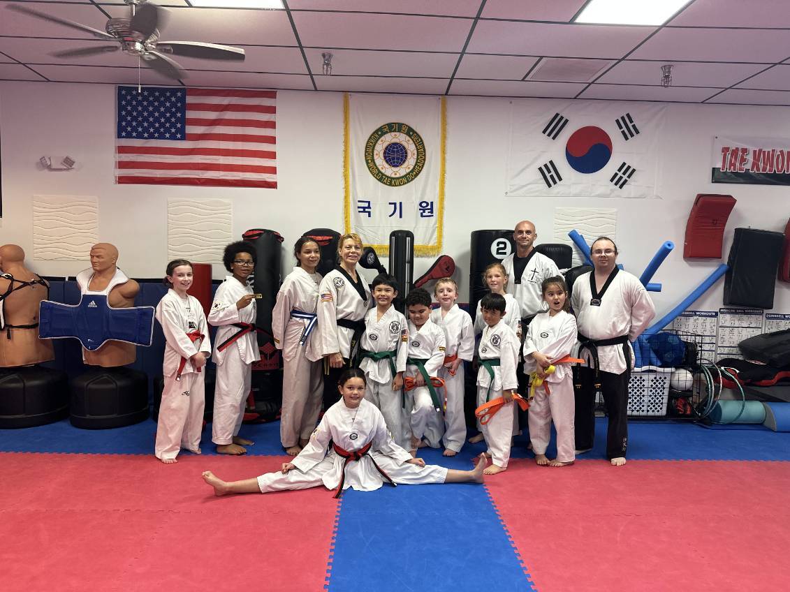 Adult students earning their belt ranks at White Tiger Taekwondo