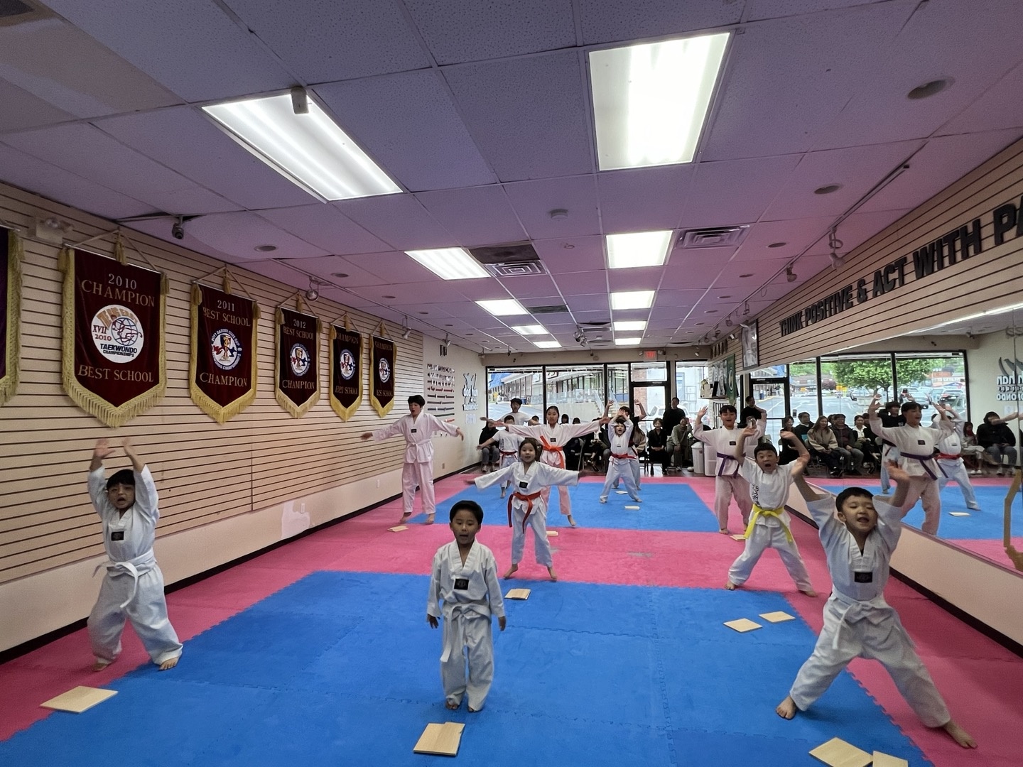 Kids practicing Taekwondo kicks