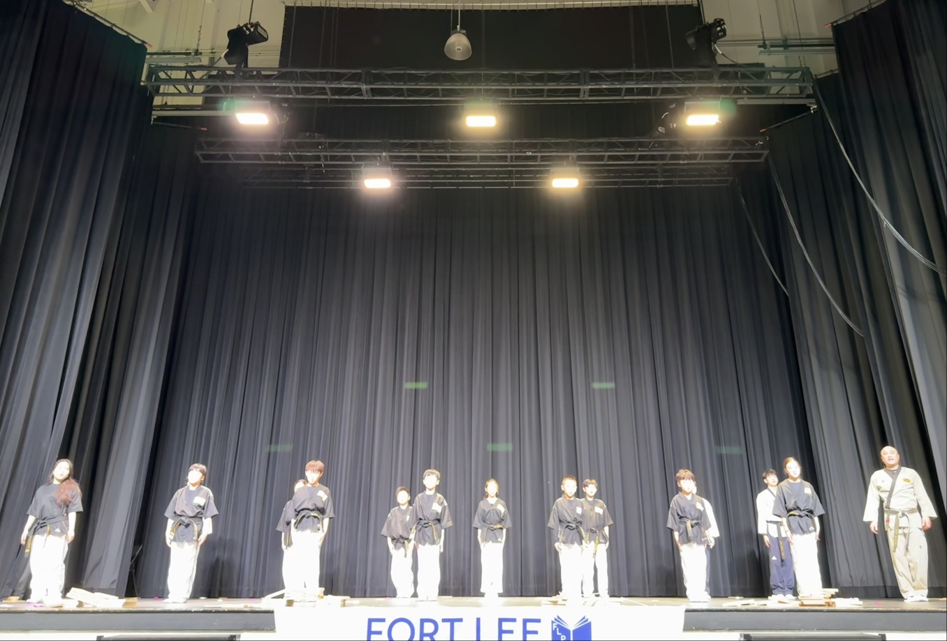 Taekwondo demonstration on stage in Fort Lee