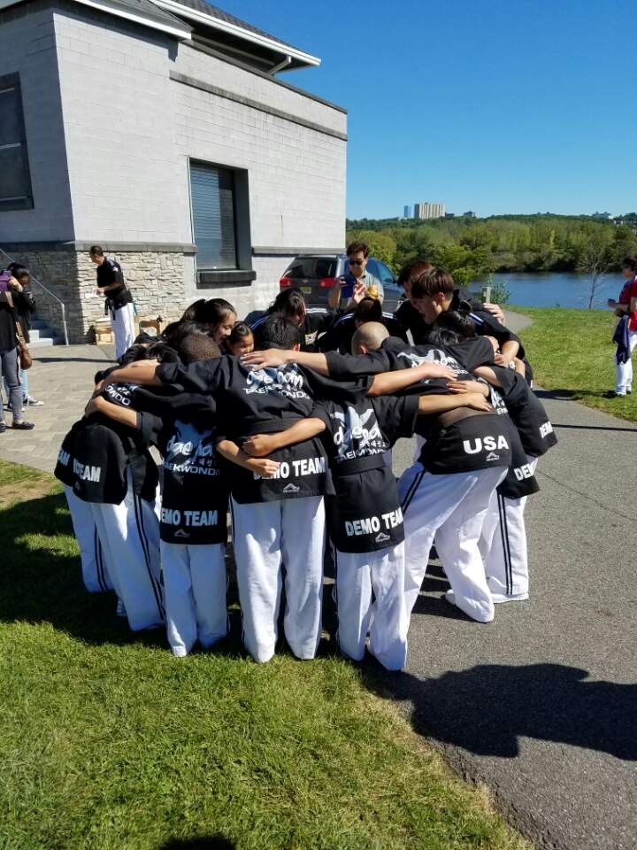 Dae Han Taekwondo demo team huddle