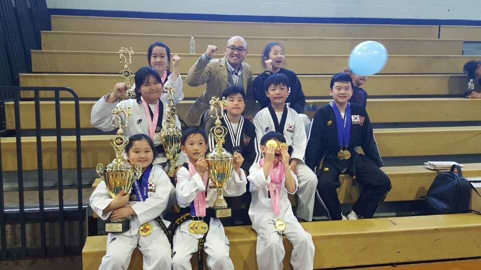 Dae Han Taekwondo students with trophies