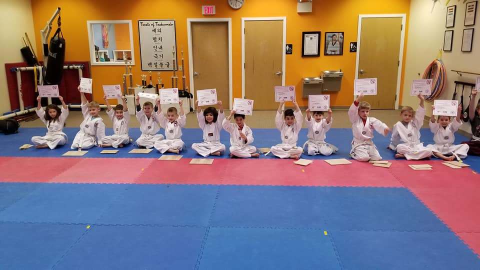 Tiny Tigers students holding their certificates in Lancaster