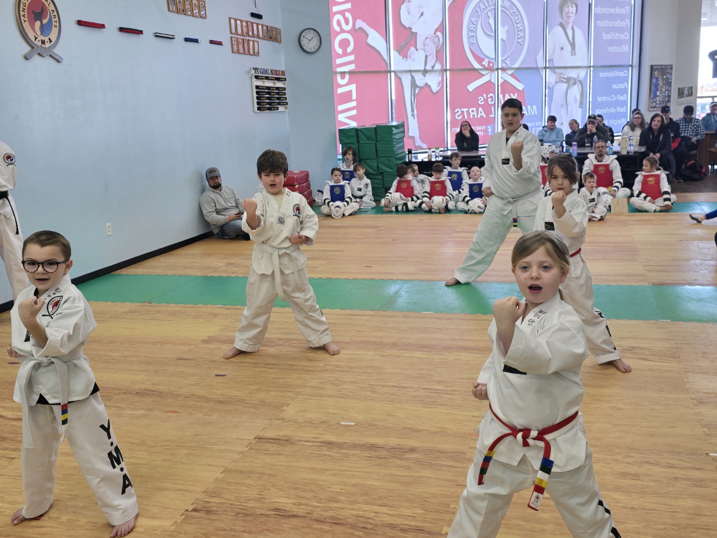 Kids earning belts through martial arts