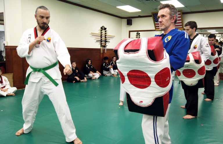 Teen and adult students sparring at Master Jung's World Taekwondo