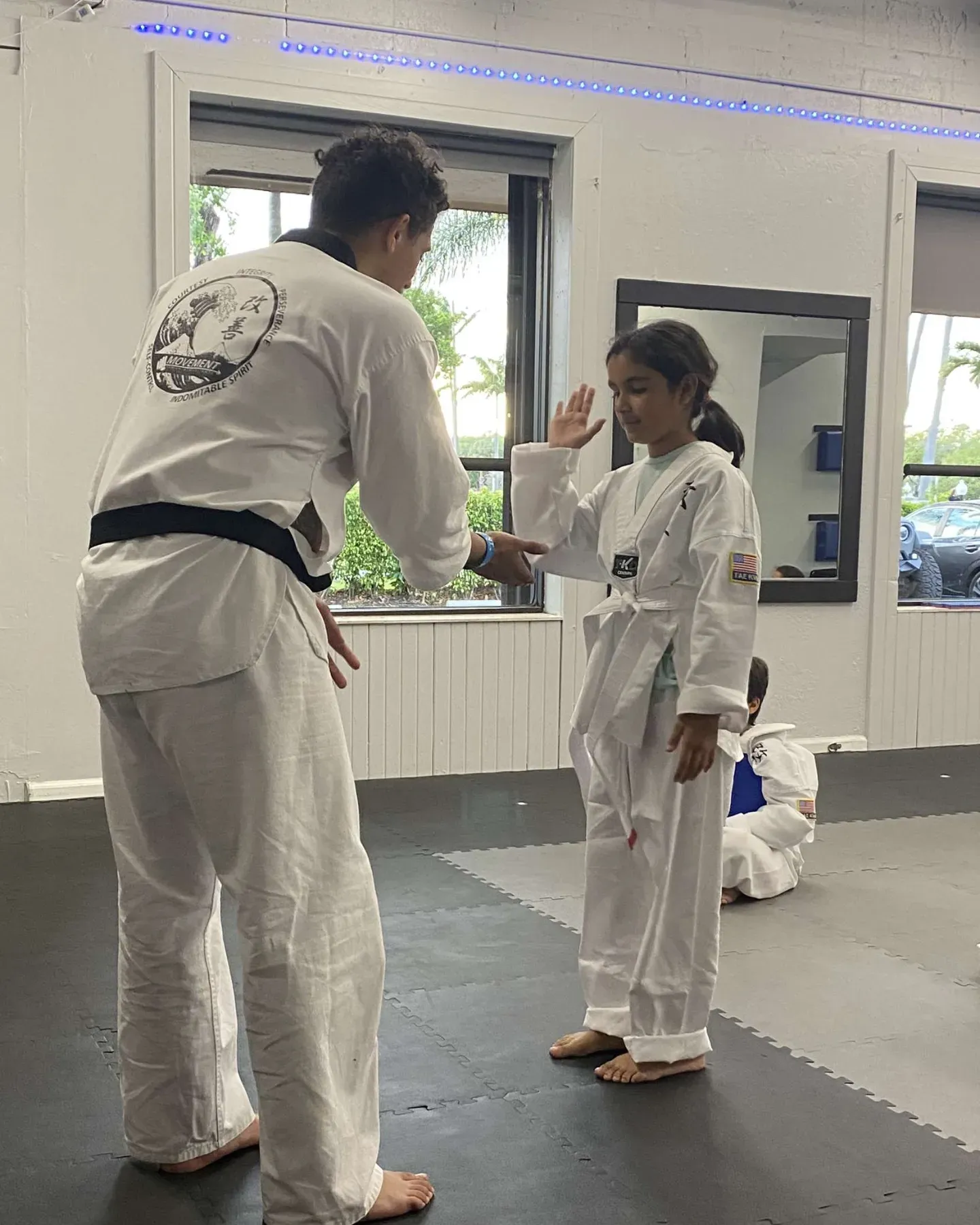 Juniors Taekwondo instructor coaching a student