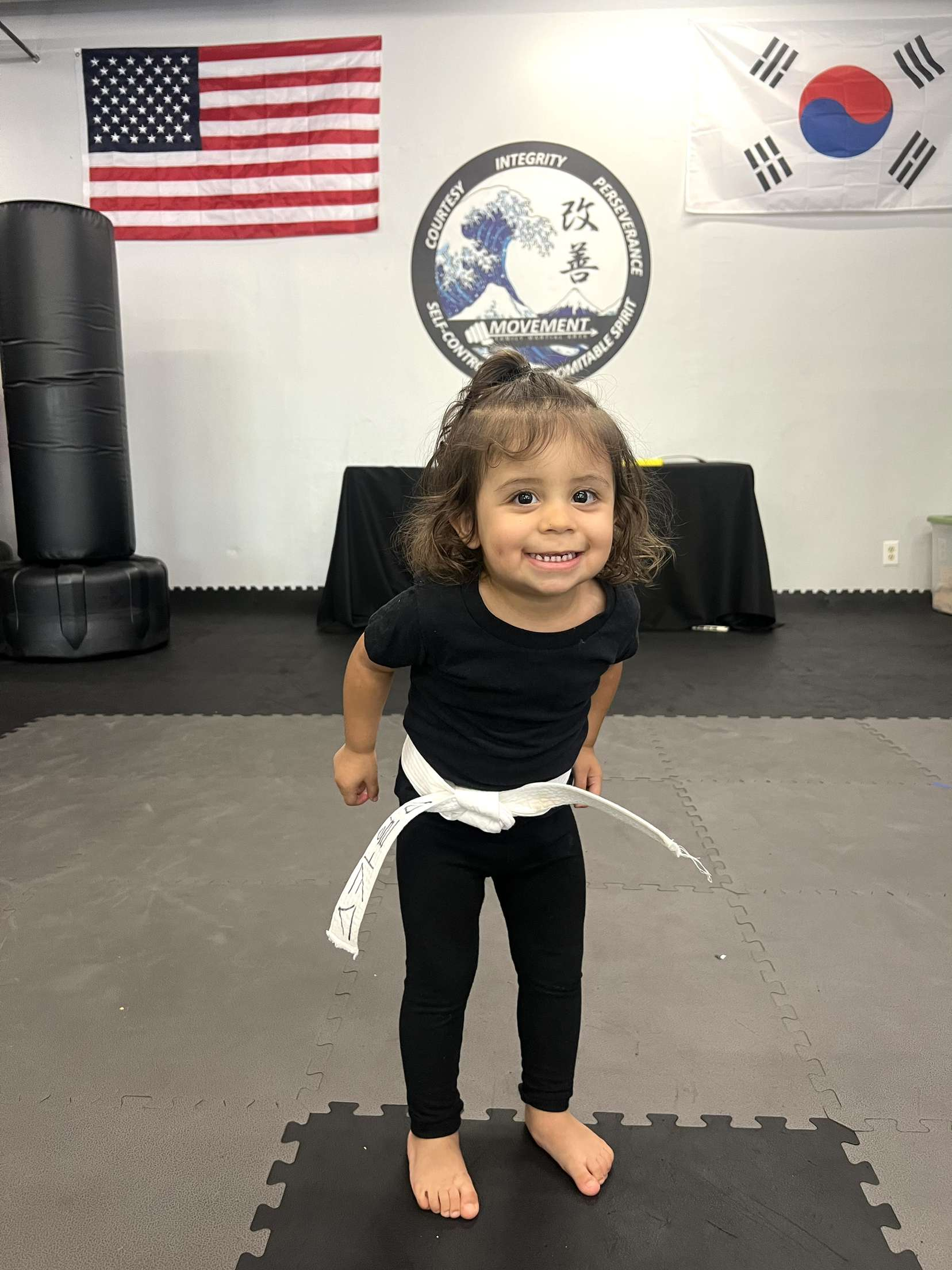 Little Champions student practicing on the mat