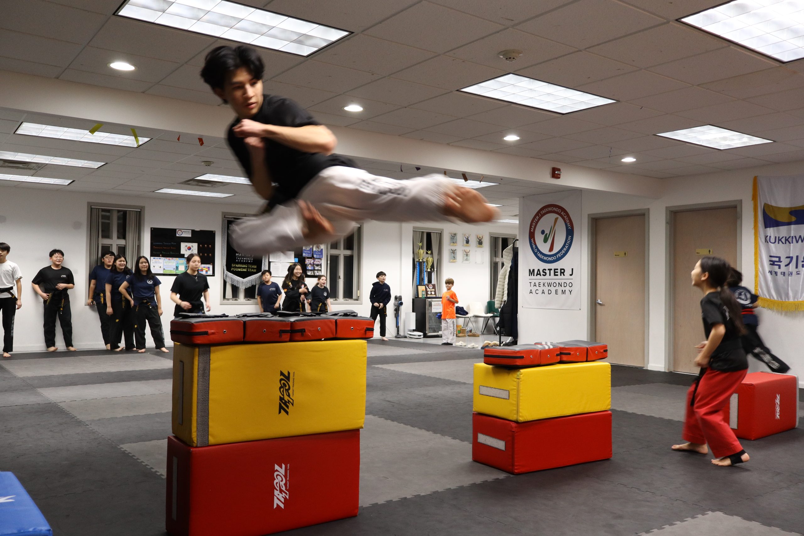 Demo Team member performing a jumping kick