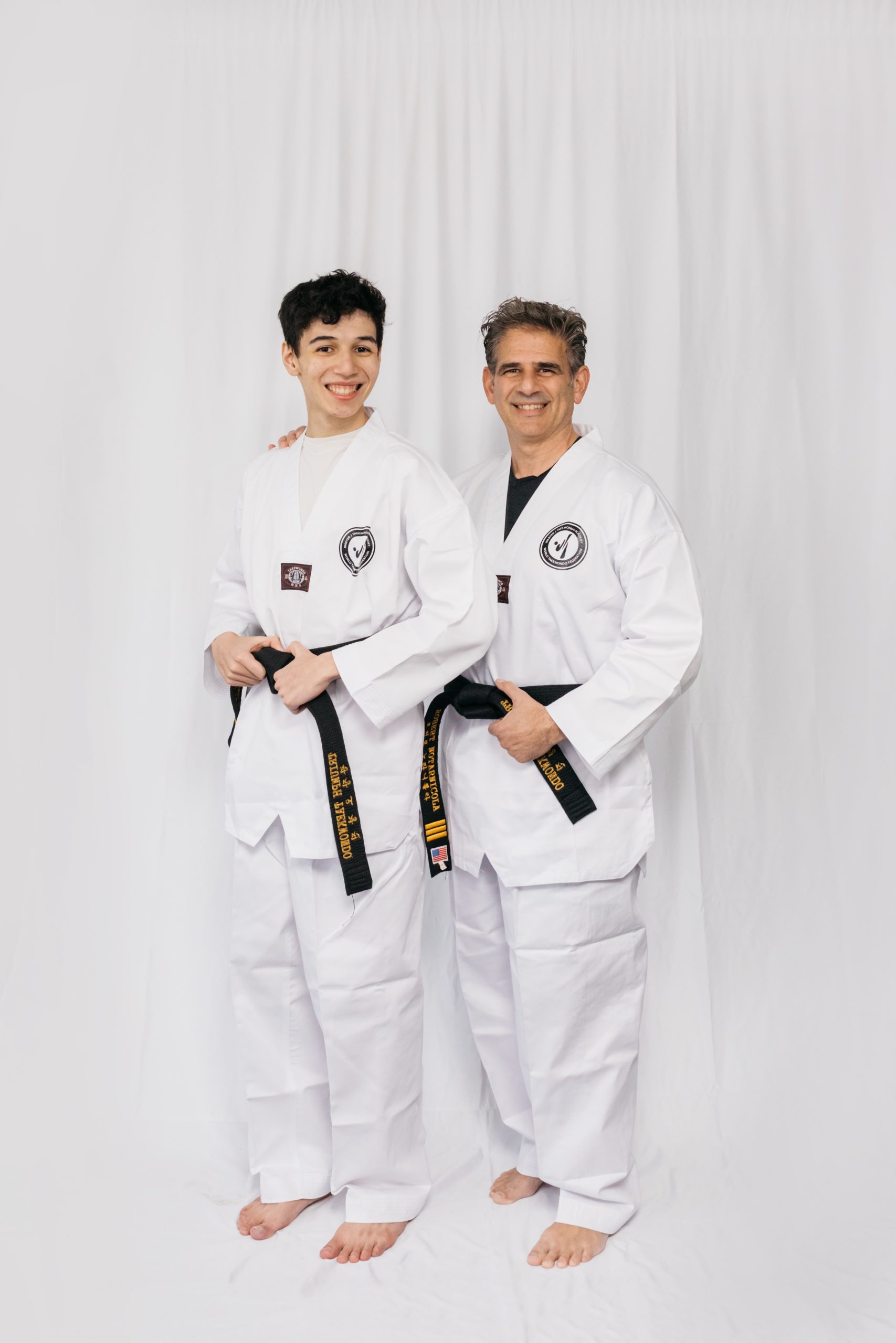 Parents and children practicing Taekwondo side by side