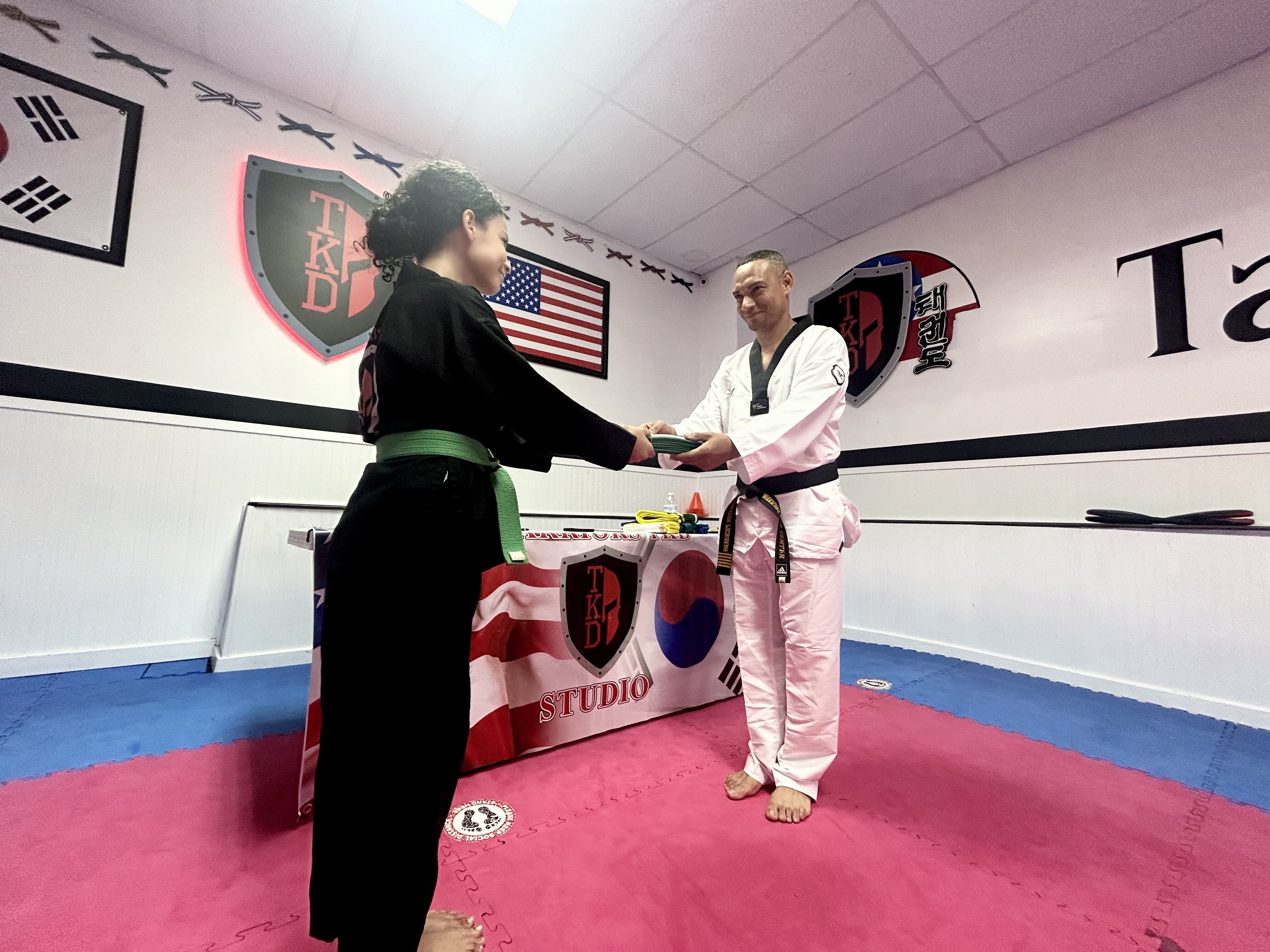 Kids learning Taekwondo techniques