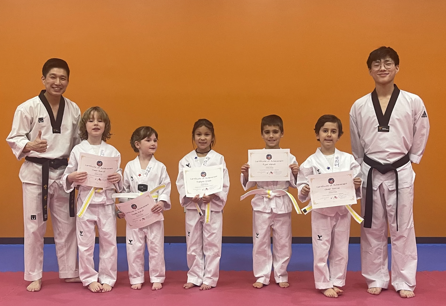 Young students and instructors at a belt ceremony