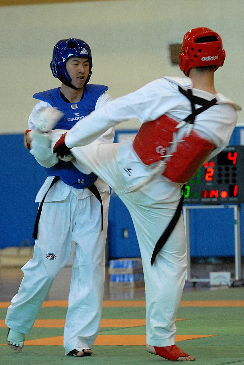 Teens and adults sparring at Chang Lee's Taekwondo in Batavia, IL