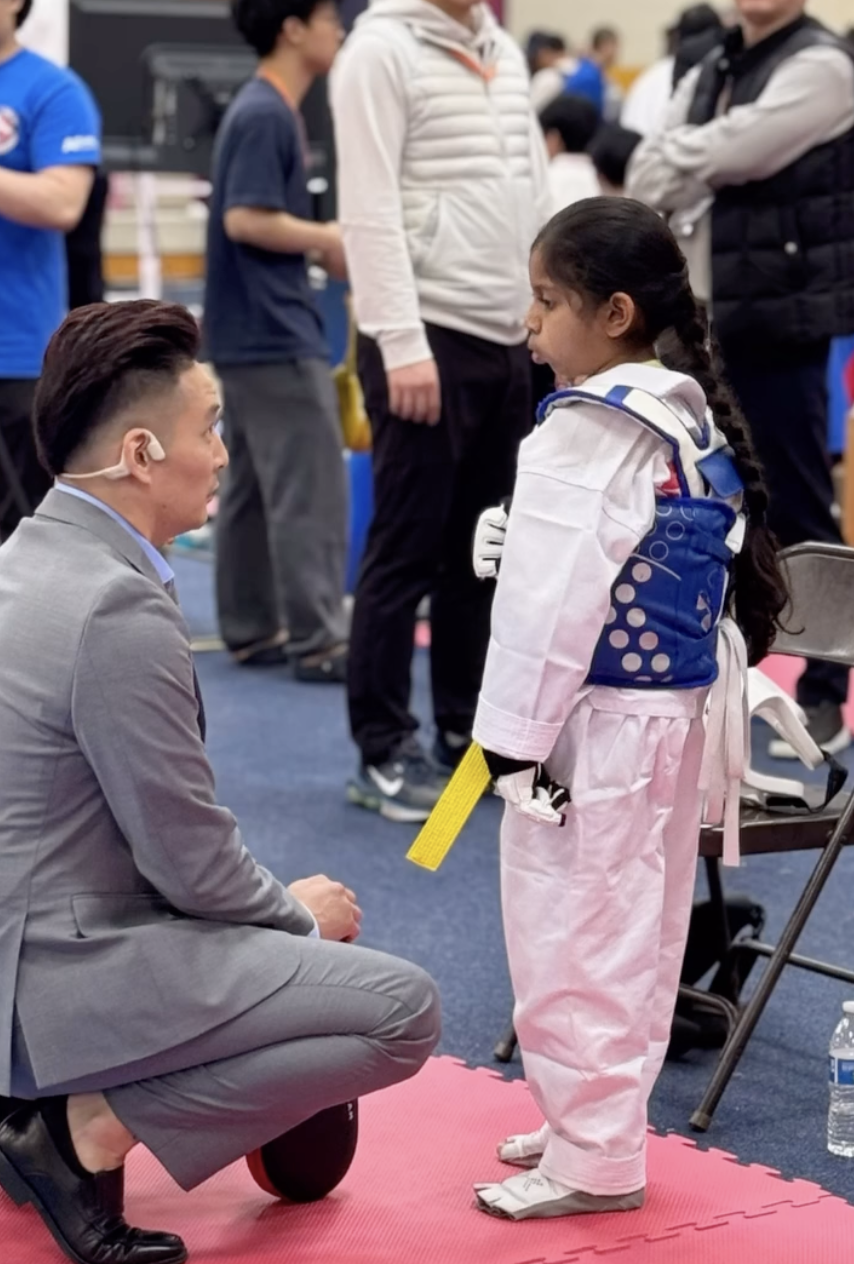 A young student with an instructor