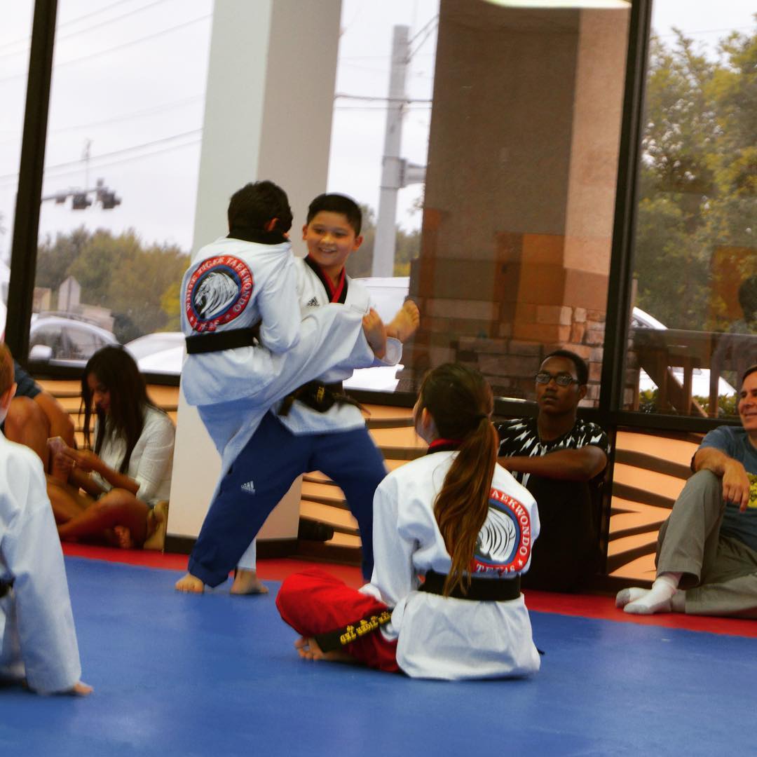 Children learning discipline through Taekwondo