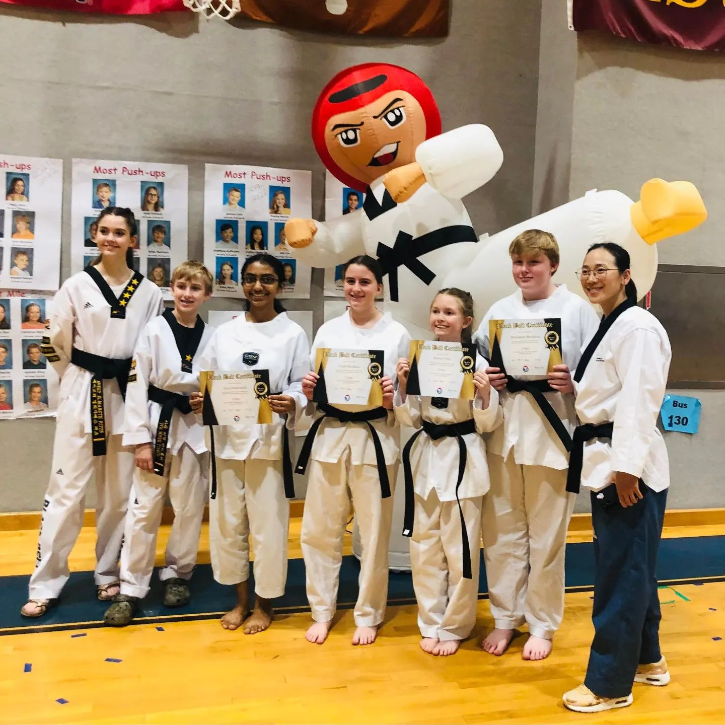 Teens and adults practicing self-defense techniques