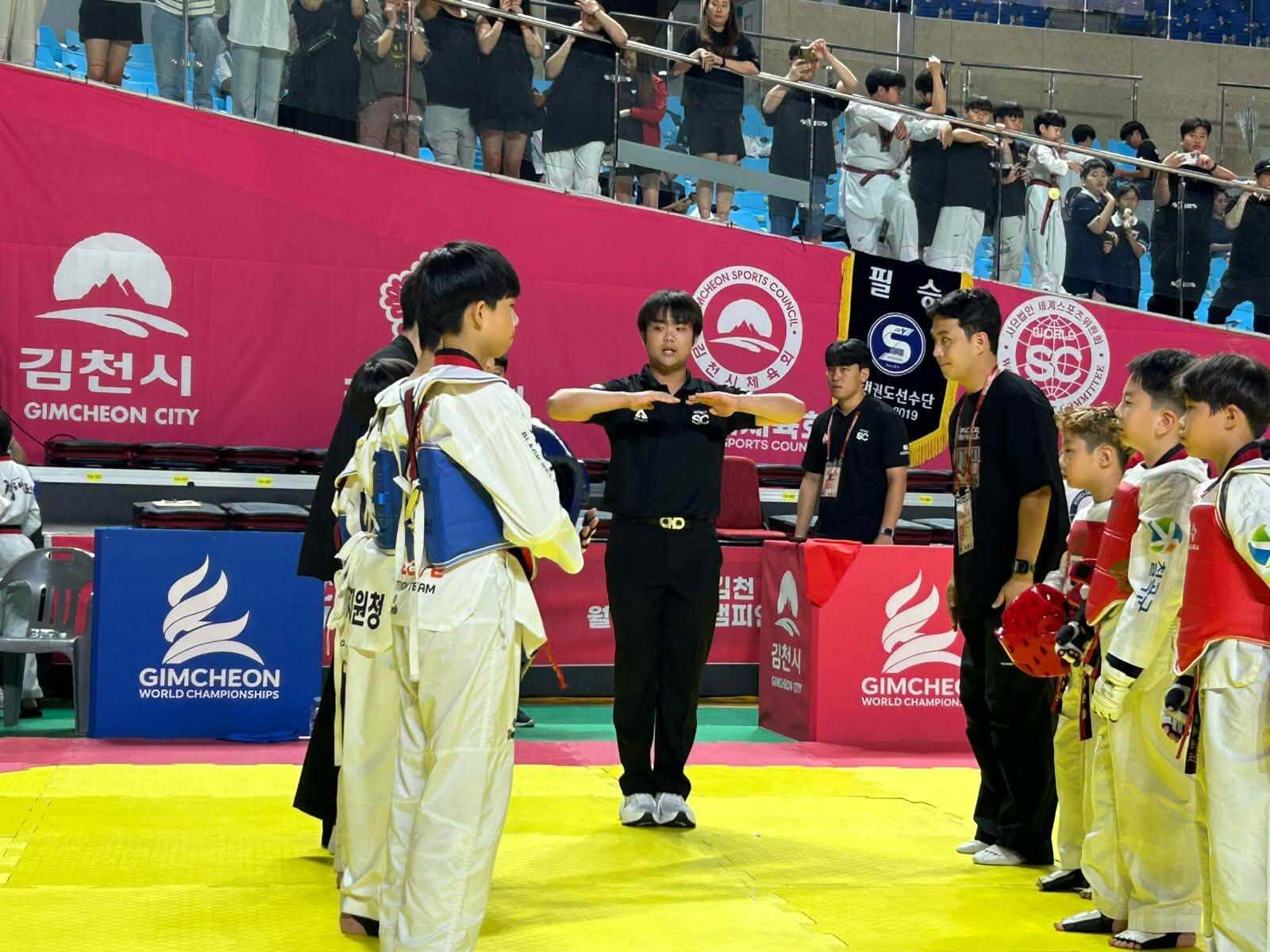 Youth referee officiating a match at the 2026 Gimcheon World Championships