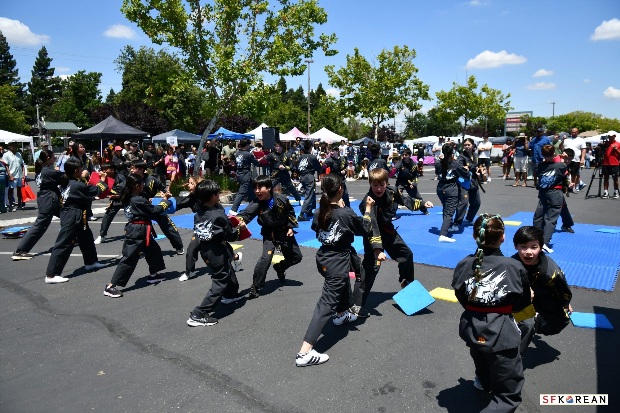 Na Martial Arts team performing at an outdoor community event