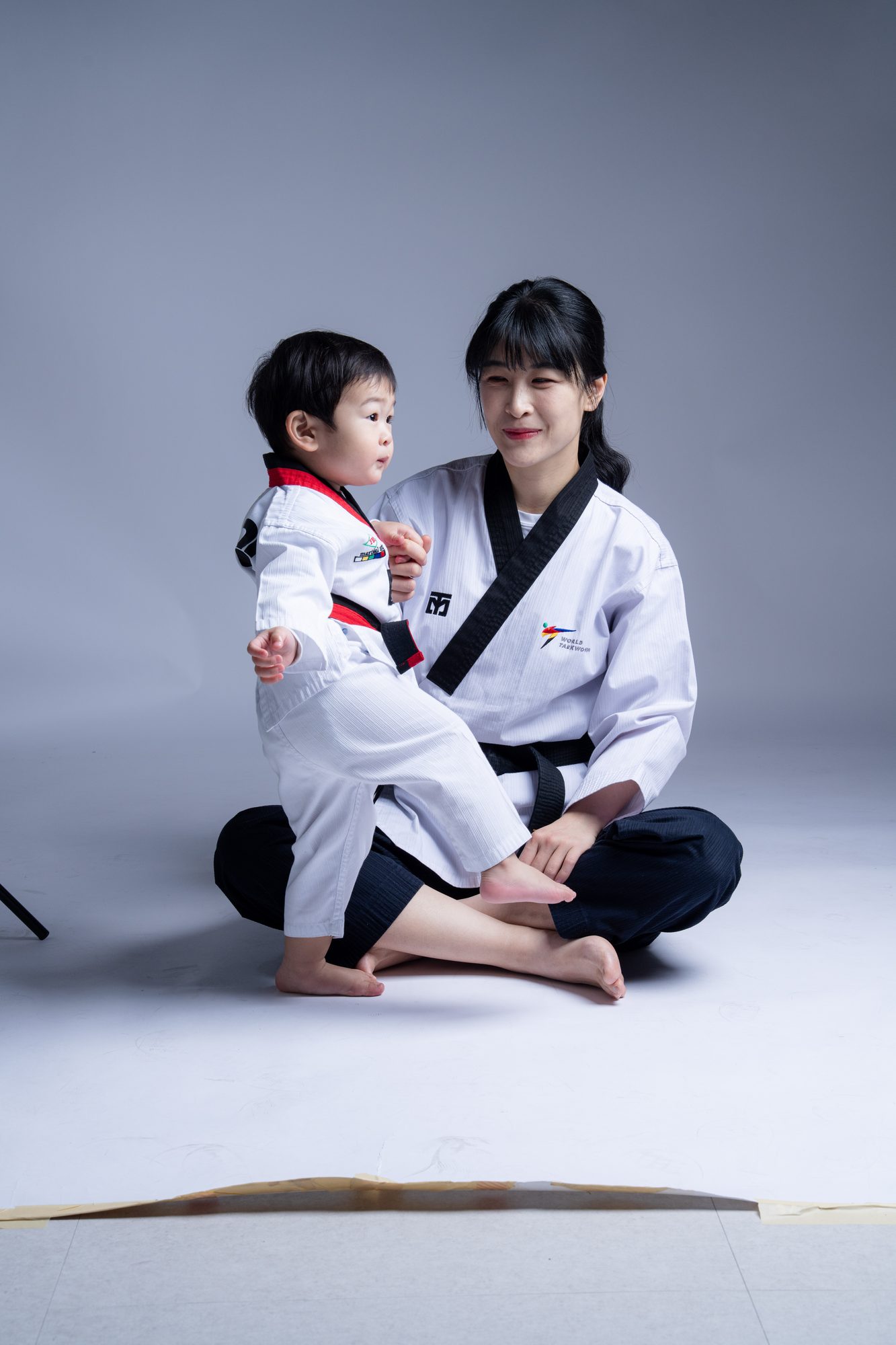 Master Na and a young student practicing a punch