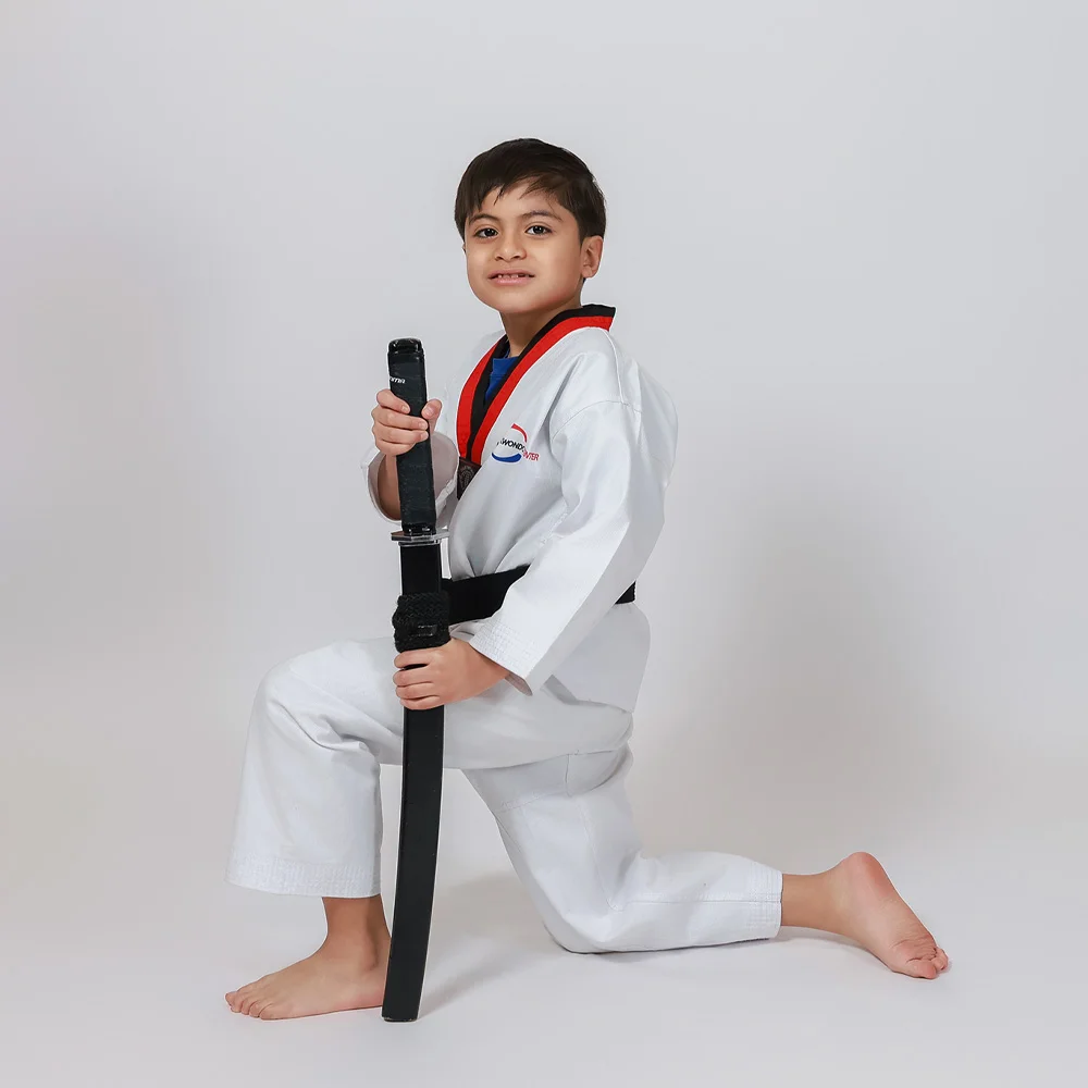 Taekwondo student side kick