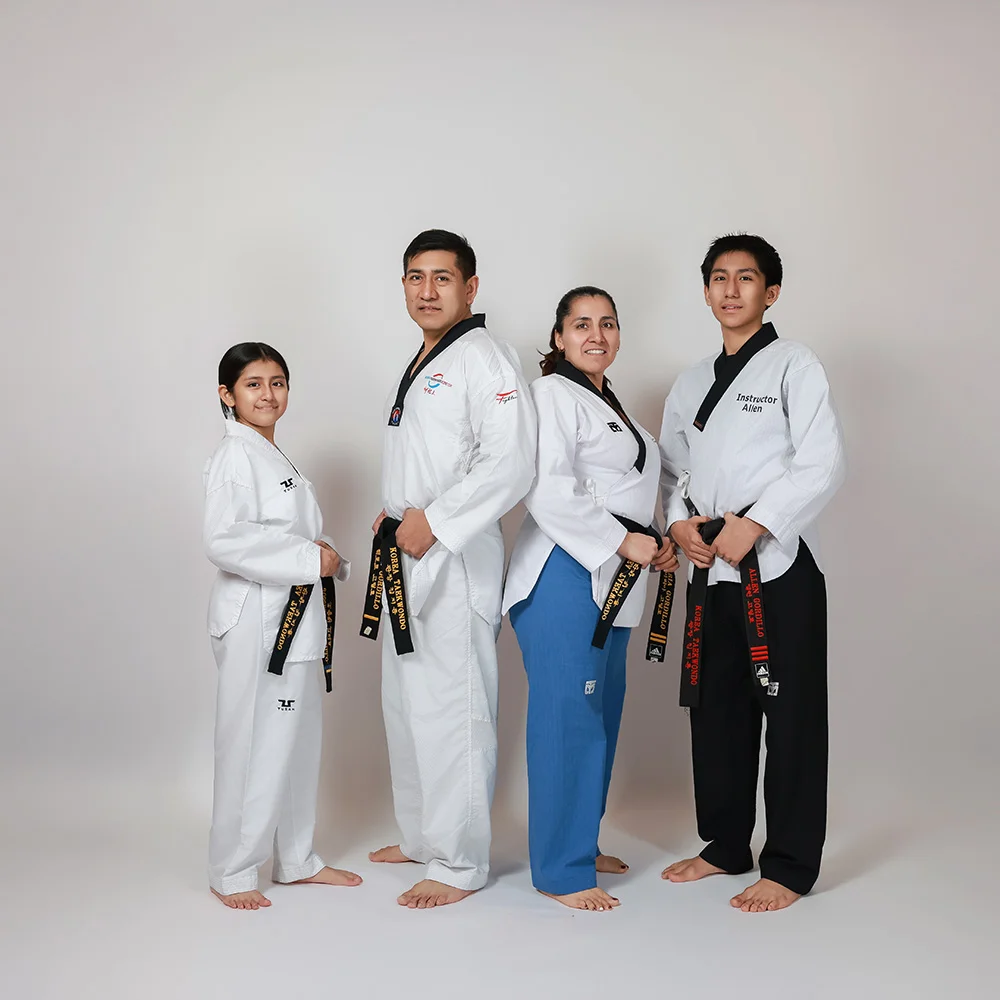Taekwondo family with colored belts