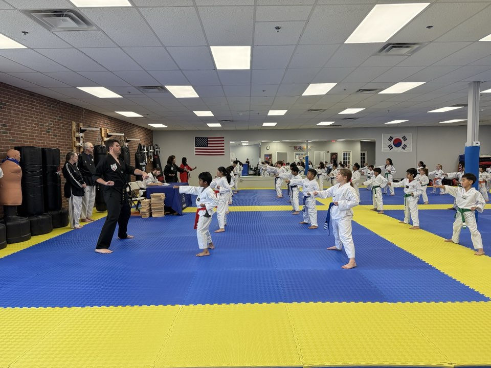 Children building confidence through martial arts training