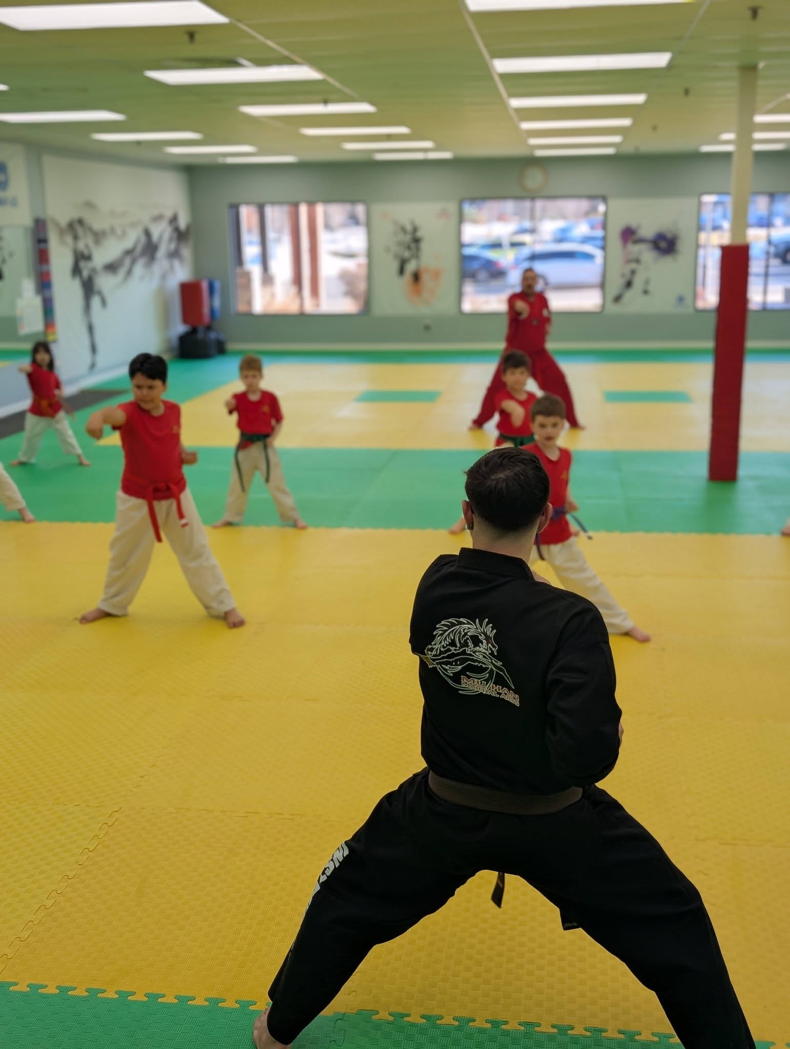 Children building confidence through martial arts training