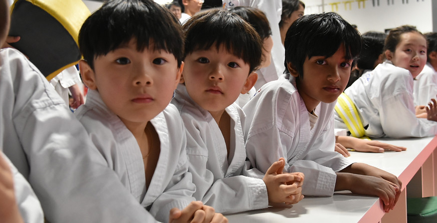 Student earning new belt rank