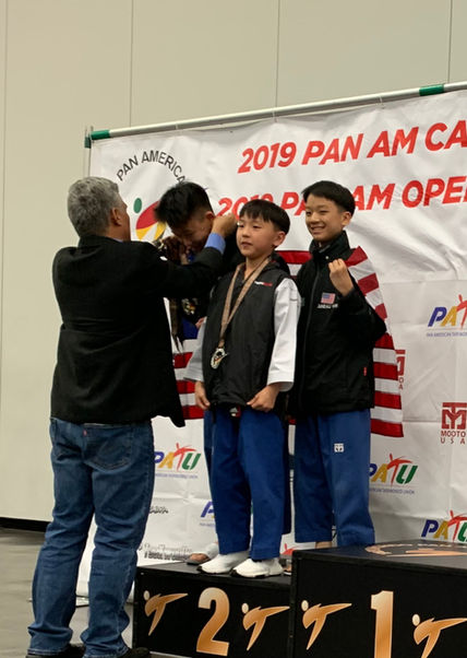 Taekwondo student side kick