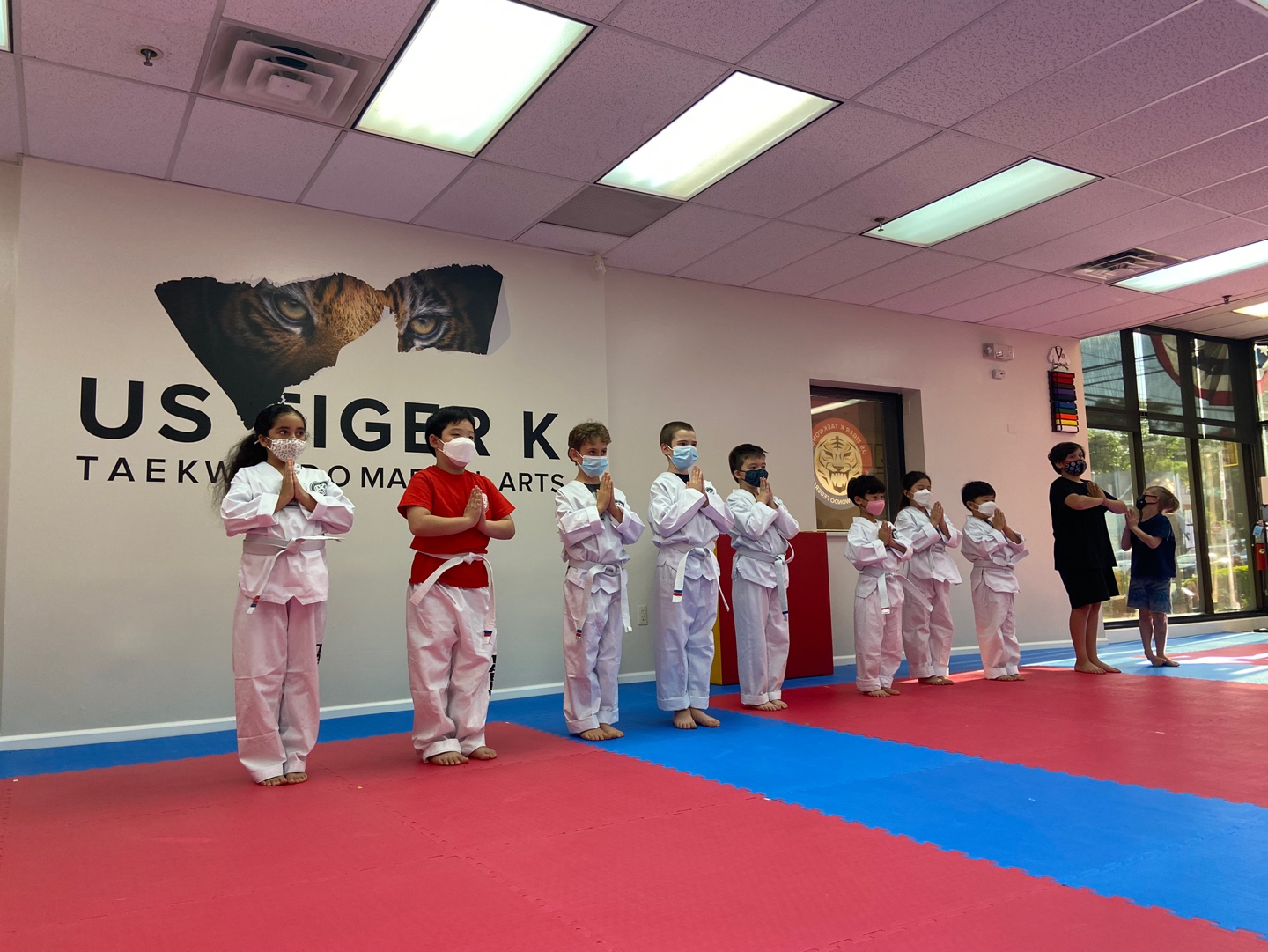 Little tiger students having fun learning Taekwondo