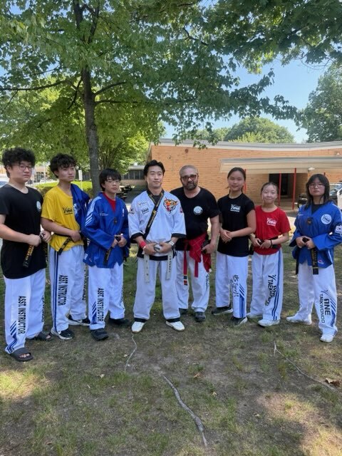 ONE TAEKWONDO MARTIAL ARTS instructor team at a community event