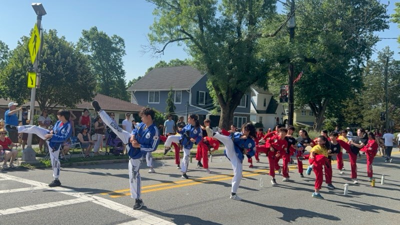 ONE TAEKWONDO MARTIAL ARTS demonstration team at a local parade