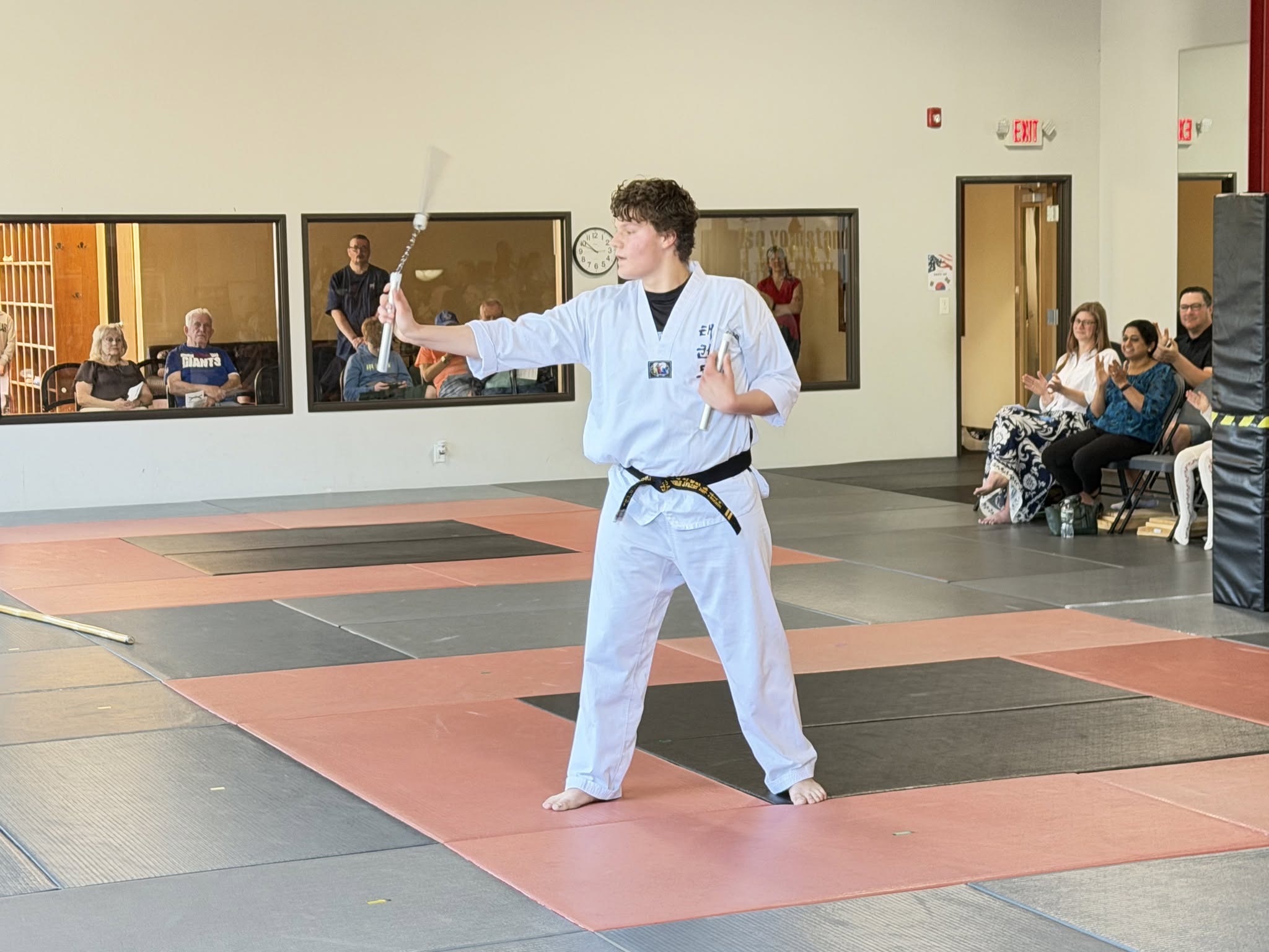 Student practicing traditional martial arts weapons