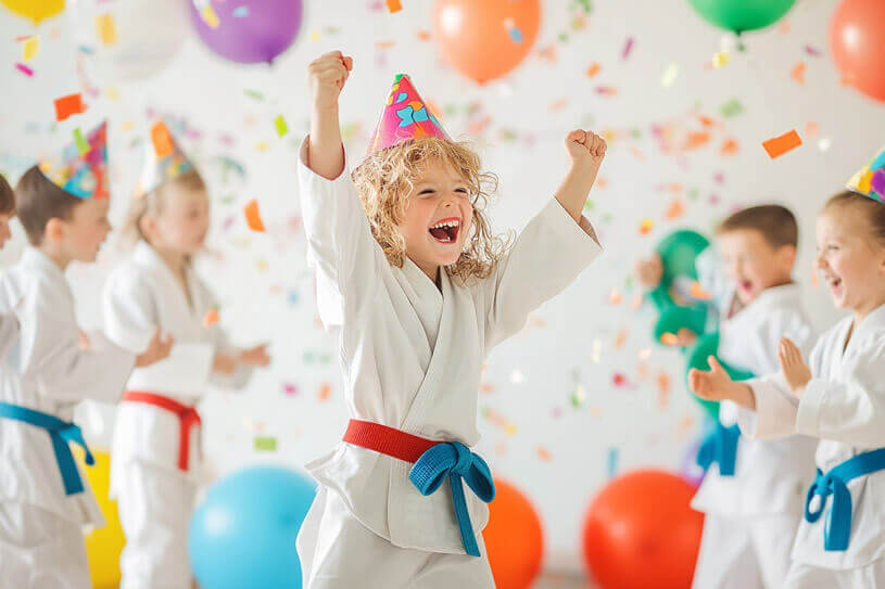 Kids celebrating birthday party with martial arts