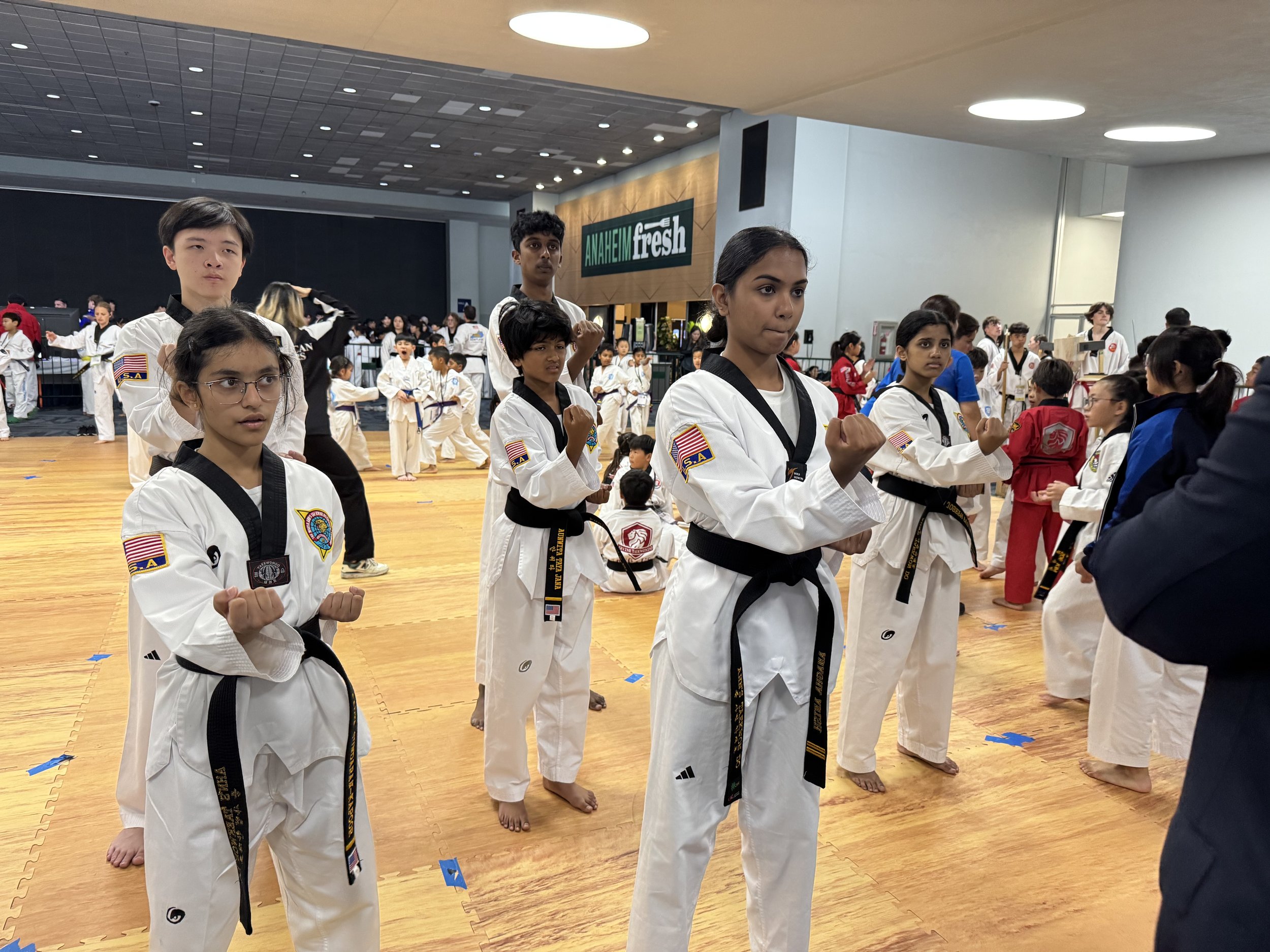 Black belt class training together in the gymnasium