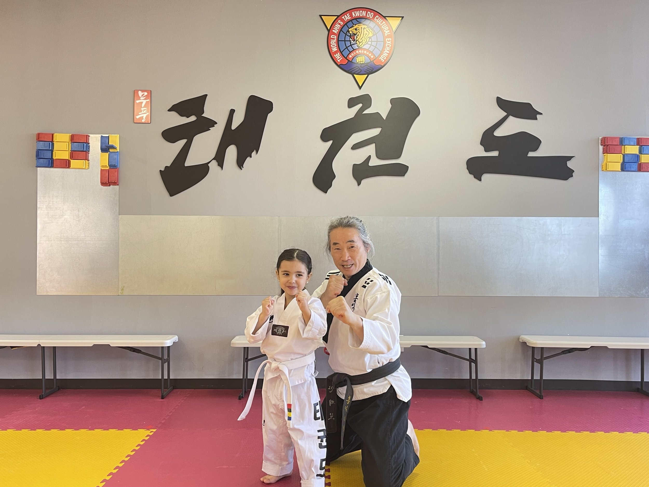 Grandmaster Jae Ro Ahn with a young student at the Plainsboro dojang