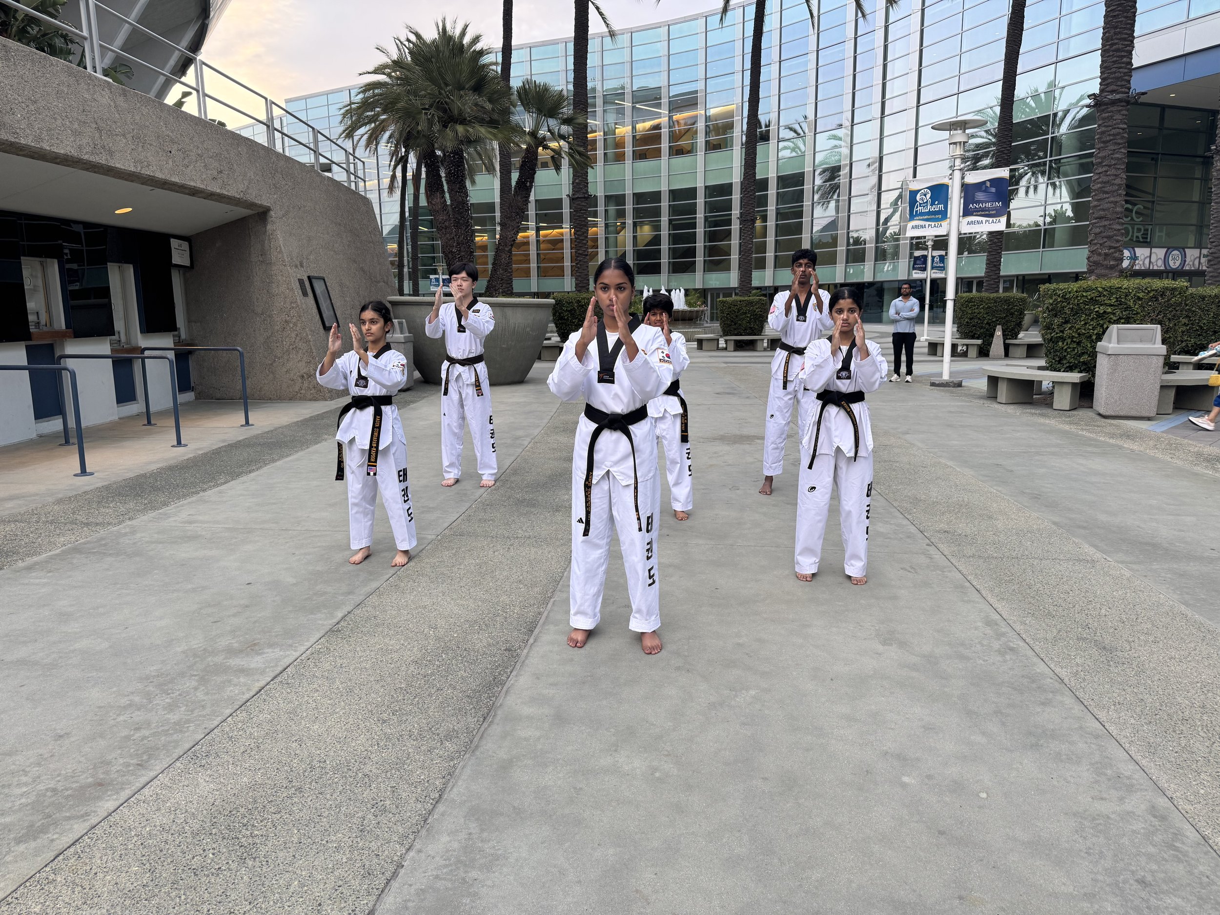 Ahn's Taekwondo team outside a competition venue