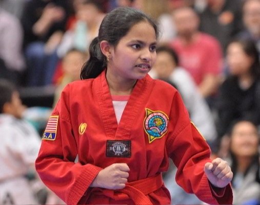 Young student focused during Taekwondo training at Ahn's Taekwondo