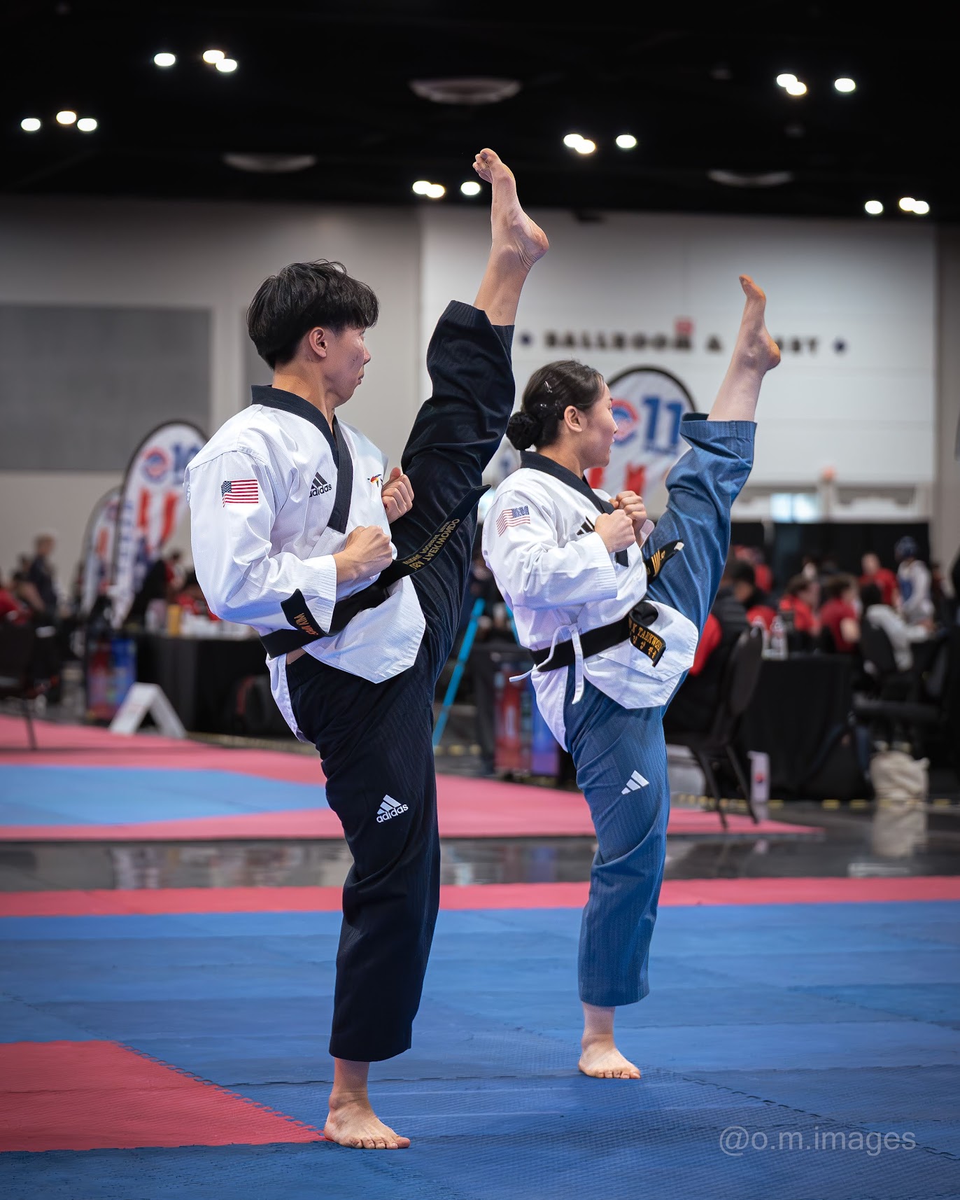Black belt students competing in pair poomsae at a championship