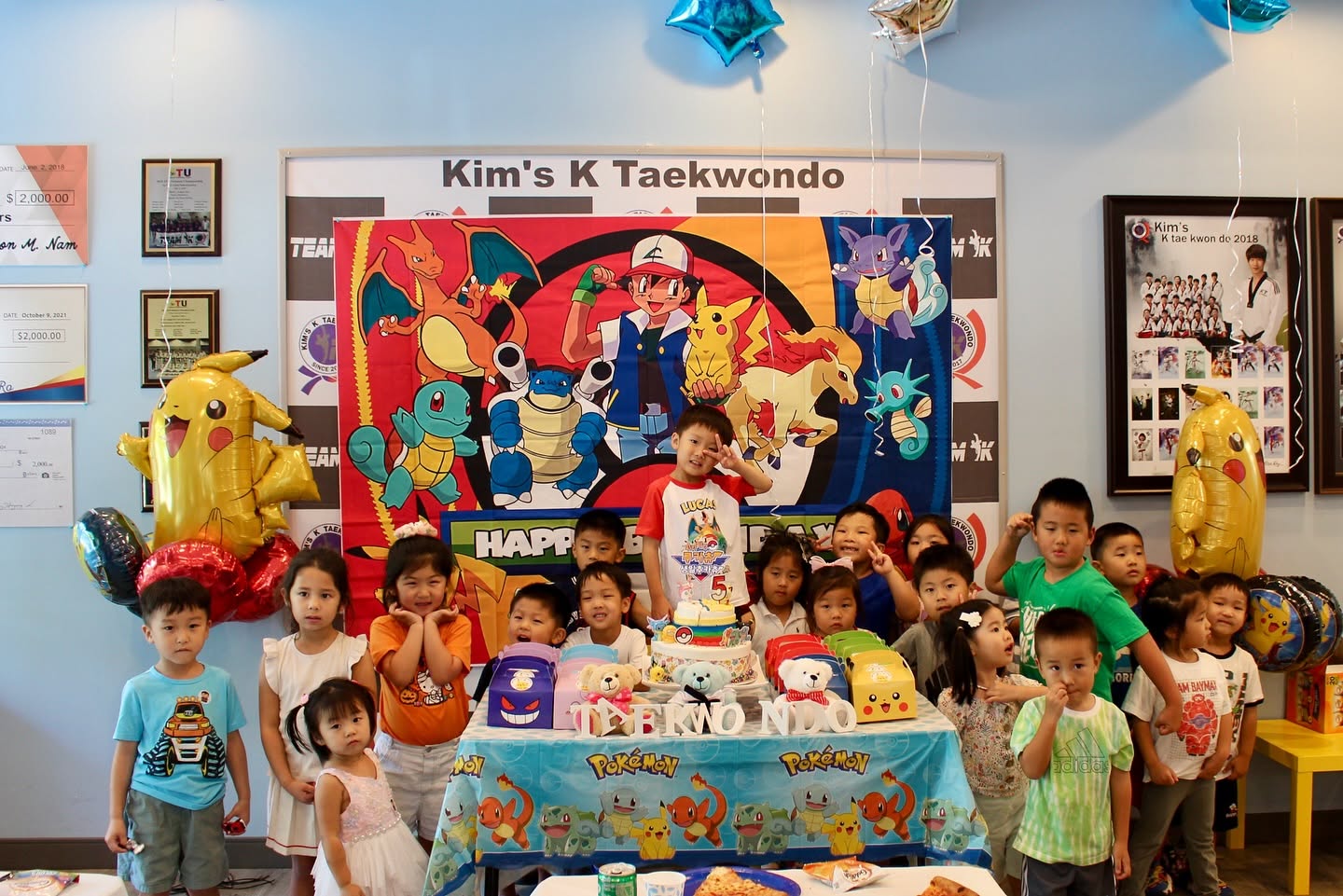 Birthday party at Kim's K Taekwondo with the birthday child, friends, cake and decorations
