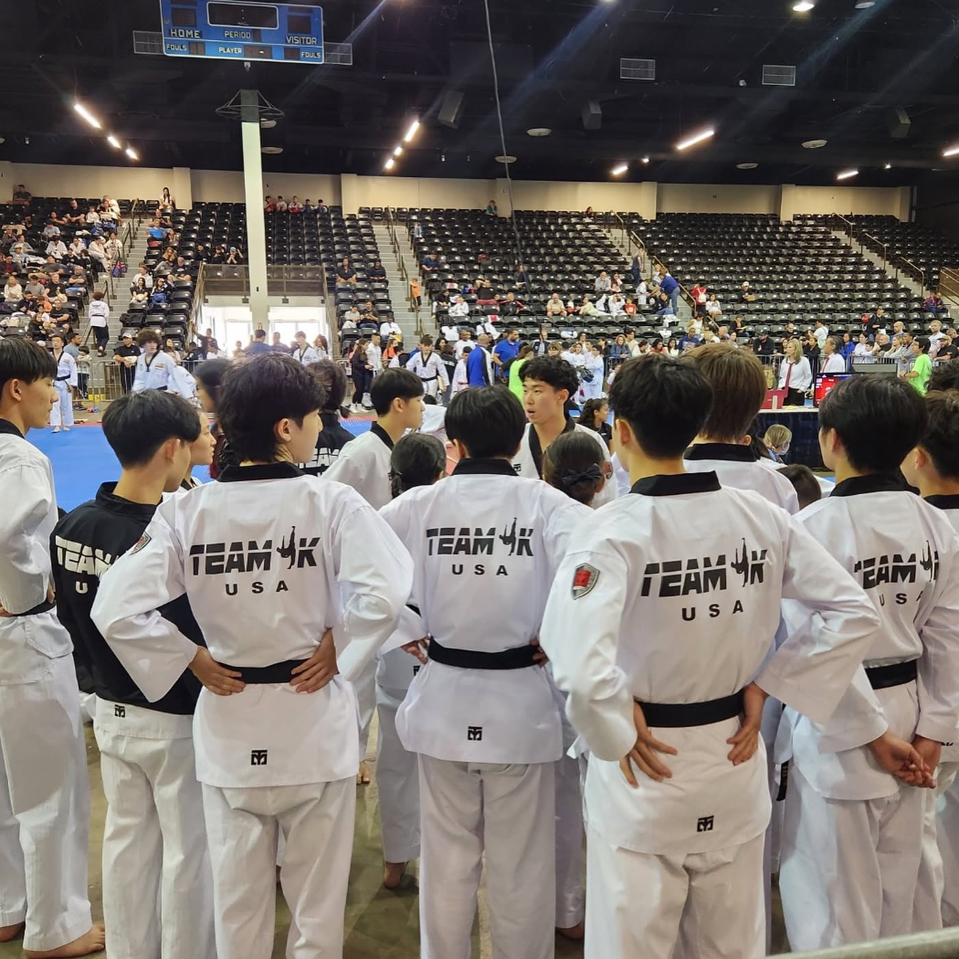 TEAM K athletes gathered with their coach at a national tournament