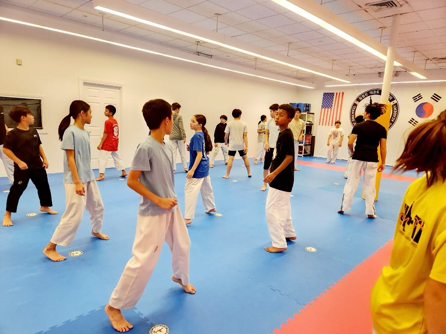 Students training and sparring together at JK Taekwondo