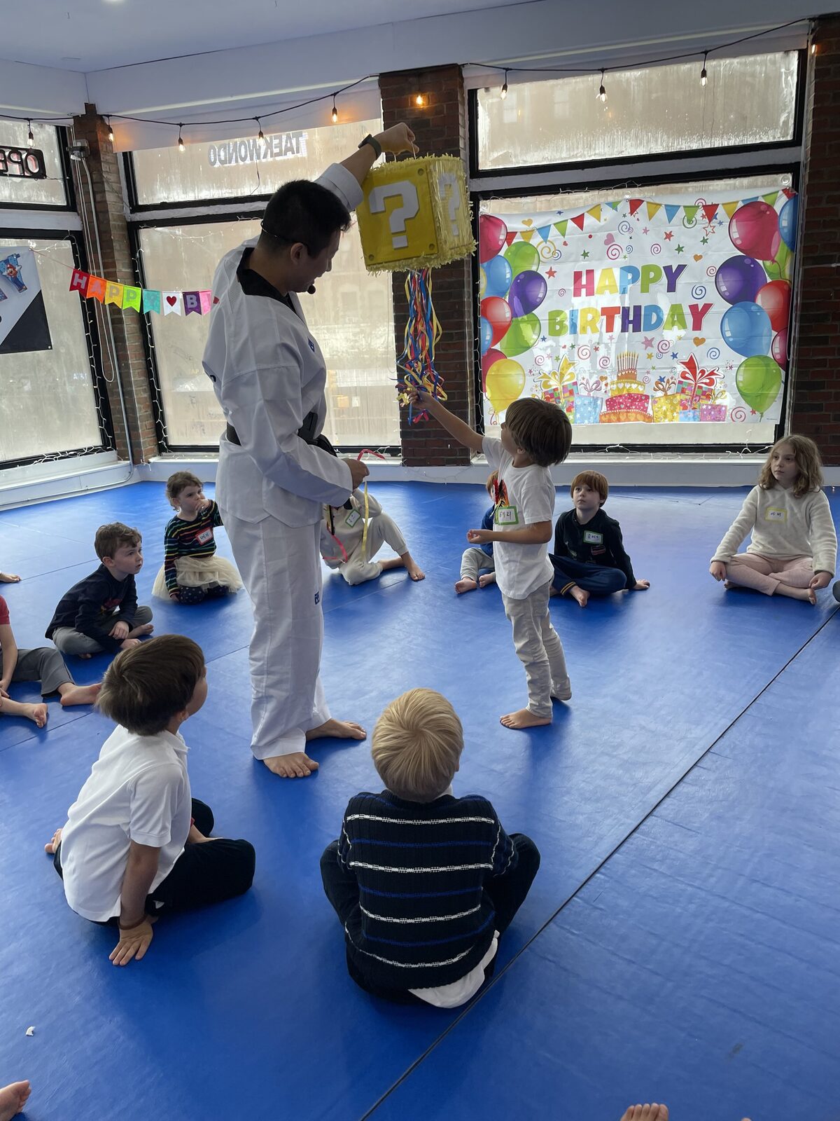 Cake time during a Taekwondo birthday party