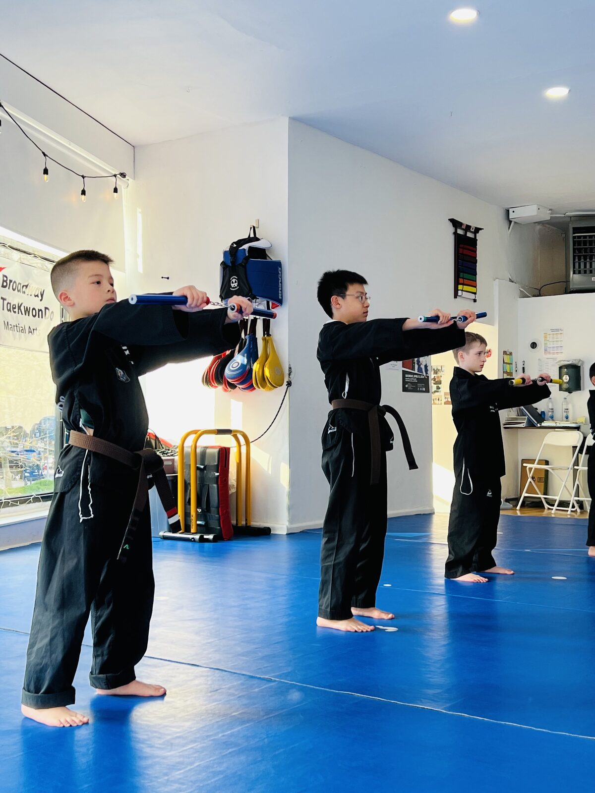 Students stretching together during class